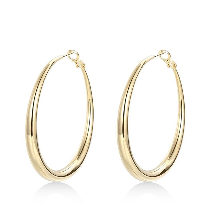 Gold hoop earrings on a white background