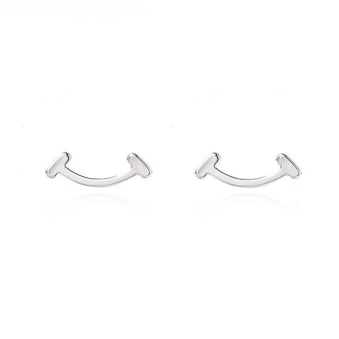 Pair of silver U-shaped earrings on a white background