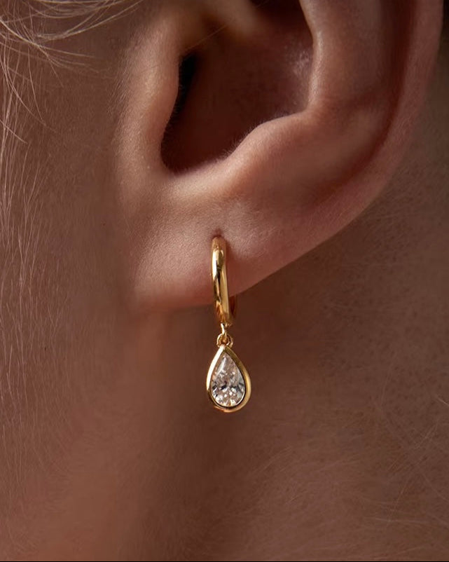 925 Silver Teardrop Hoop Earrings styled on model with casual outfit