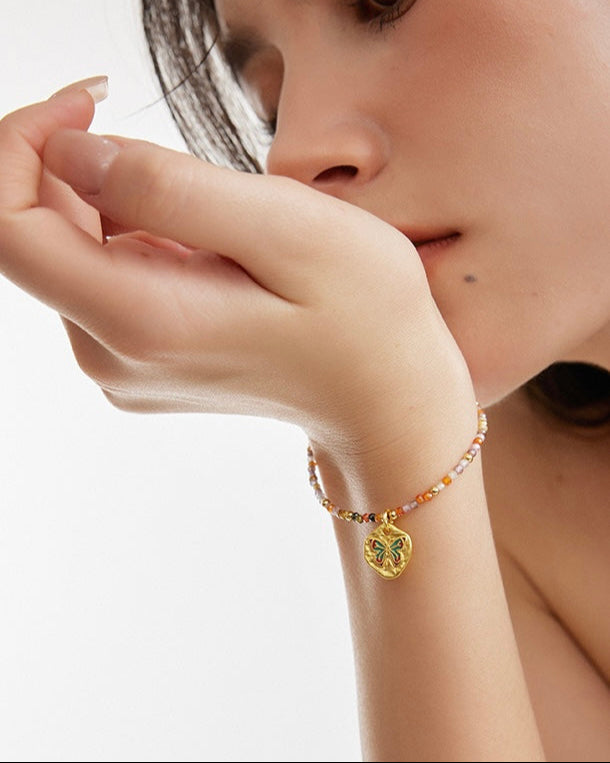 Butterfly Bloom Beaded Bracelet shown in relaxed lifestyle setting worn by model