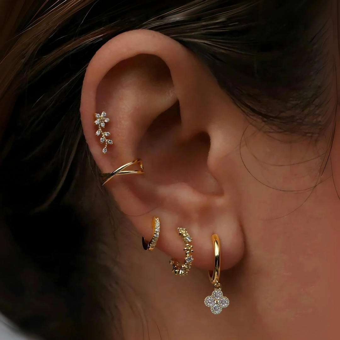 Gold Clover Earrings close-up worn by model showing four-leaf gold detail