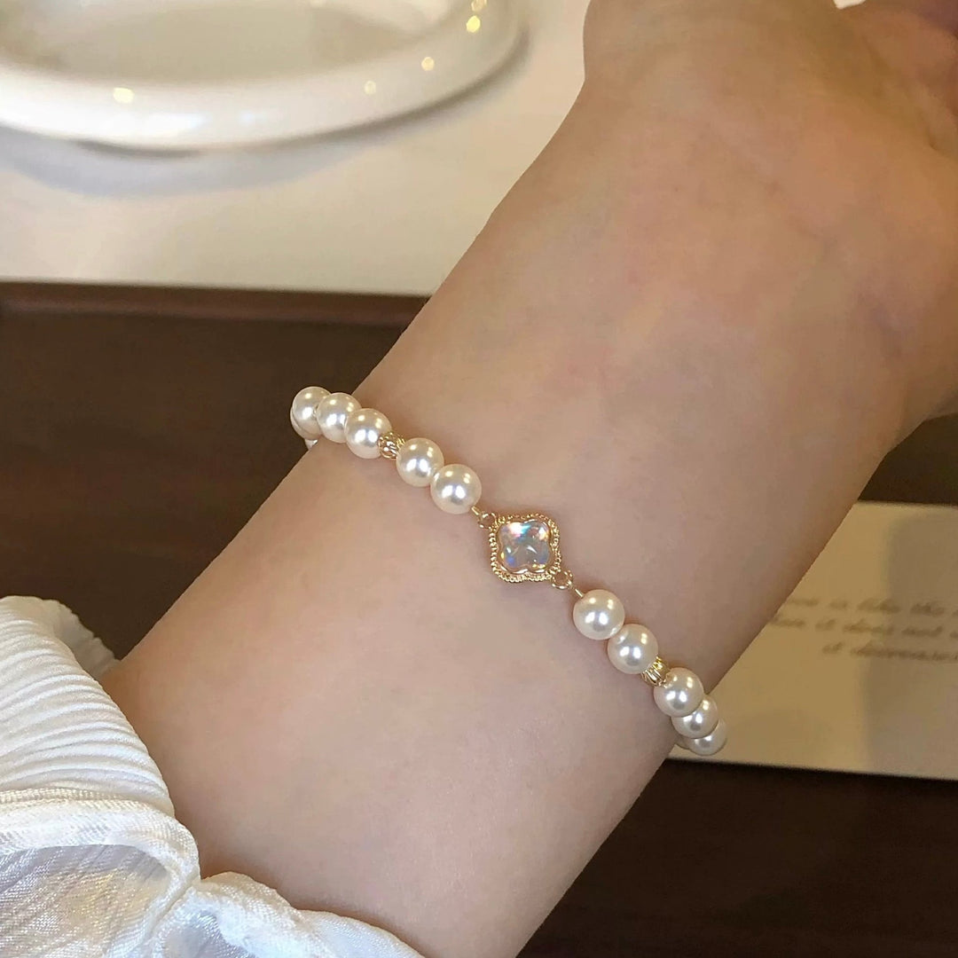 Moonlight Bracelet close-up worn on model showing crescent charm detail