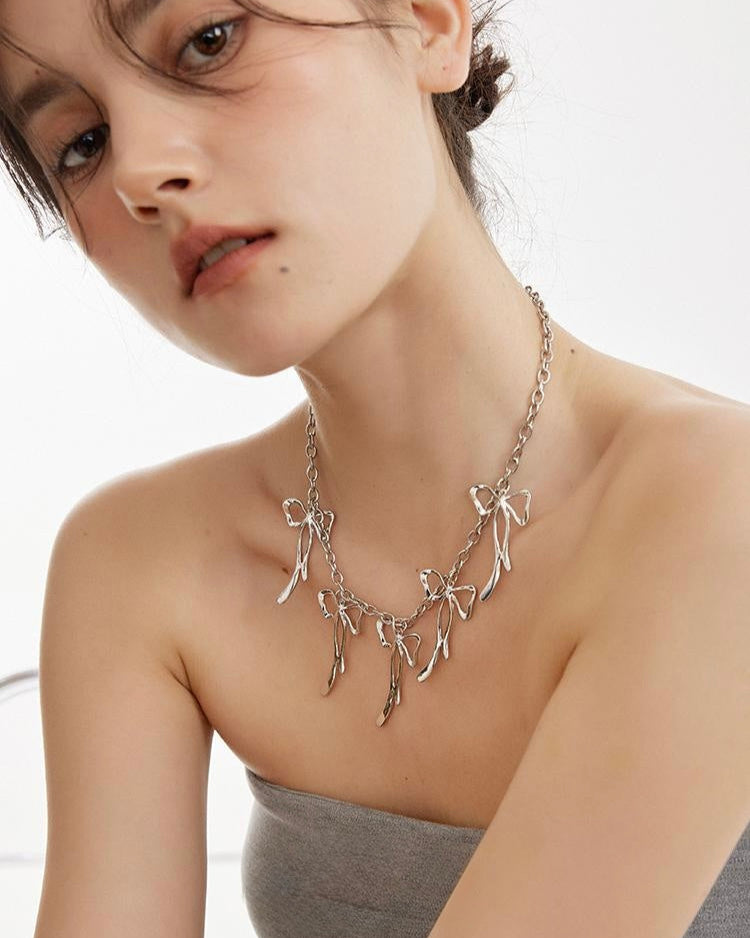 Ribbon Charm Necklace styled on model highlighting layered neckline look