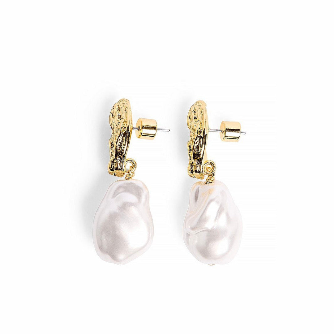 Sculpted Pearl Earrings shown from side angle highlighting sculpted gold texture on white background