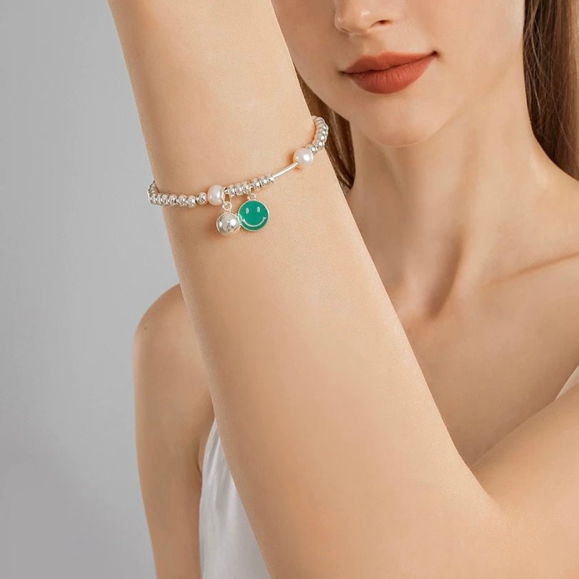 Smiley Pearl Bracelet worn by model in relaxed lifestyle setting with casual outfit