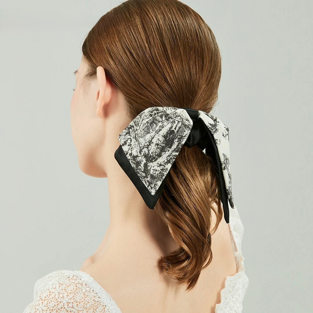 Vintage Scarf Bow Scrunchie worn by model in casual lifestyle setting