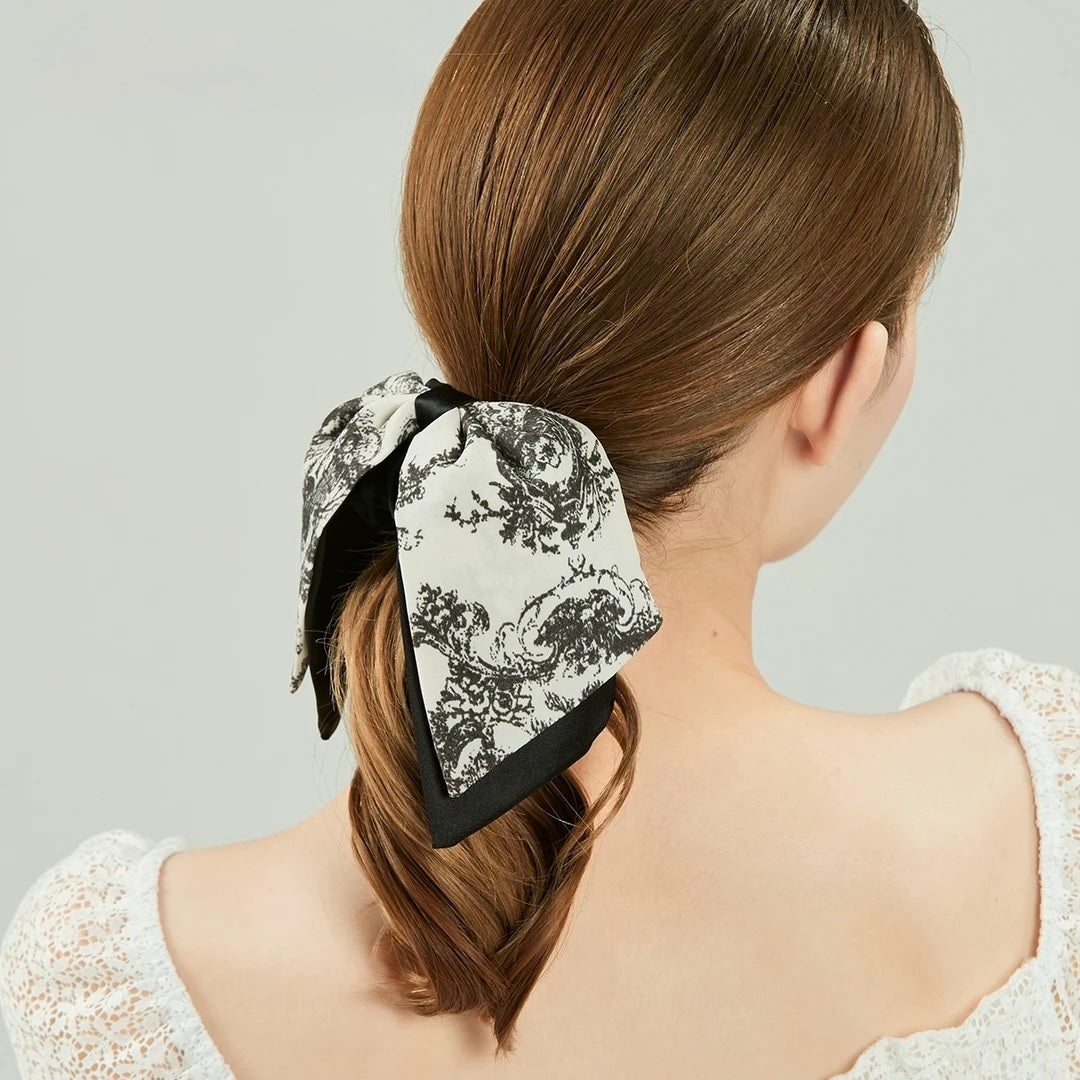 Vintage Scarf Bow Scrunchie styled on model with relaxed hairstyle