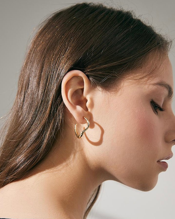 Wave Hoop Earrings worn by model in relaxed lifestyle setting