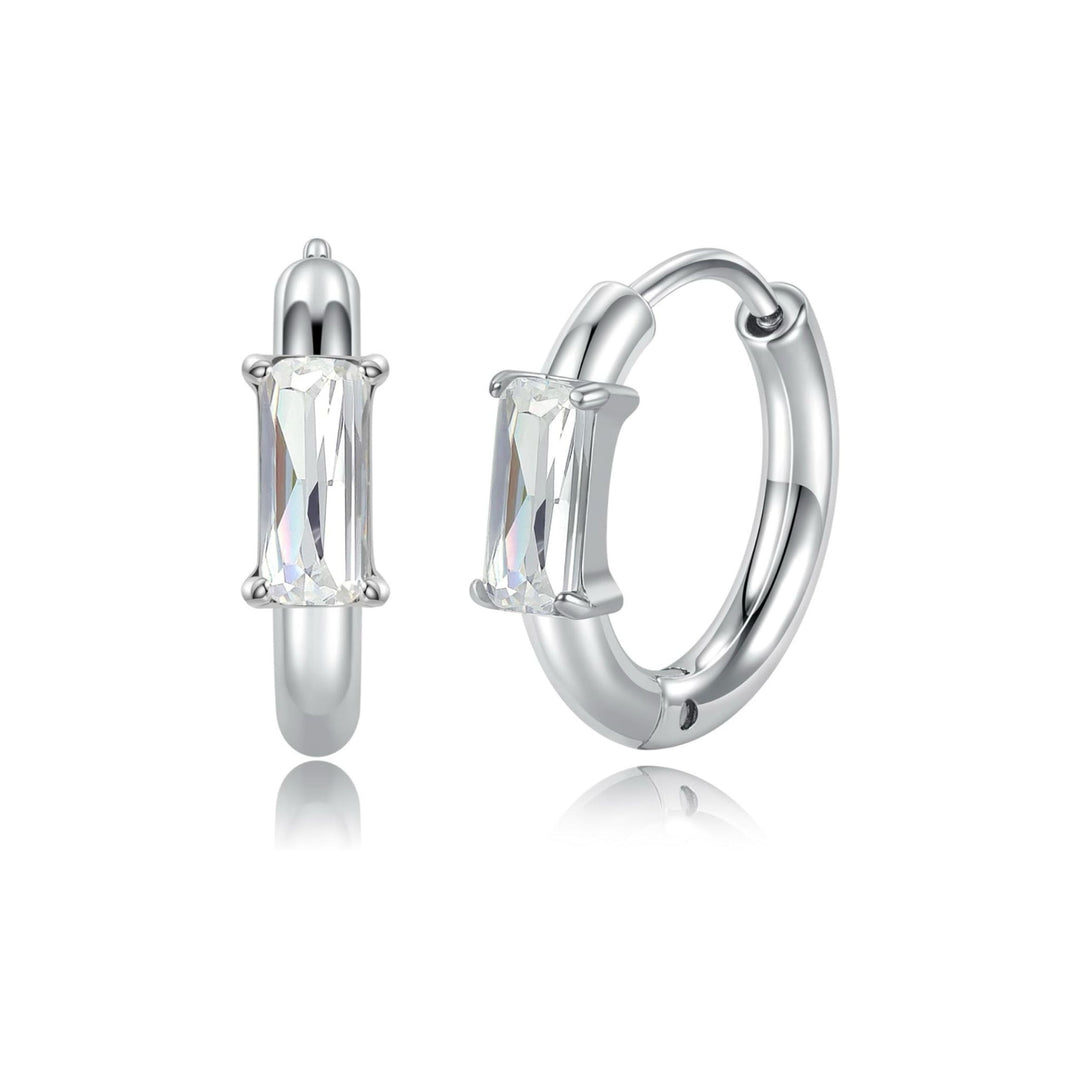 Zircon Huggie Hoop Earrings with gold-tone setting and zircon stones on white background