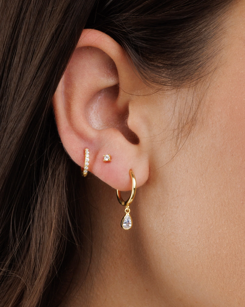925 Silver Teardrop Hoop Earrings close-up worn by model showing polished silver detail
