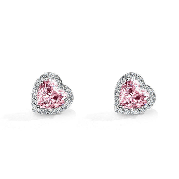 Heart-shaped pink gemstone earrings on a white background