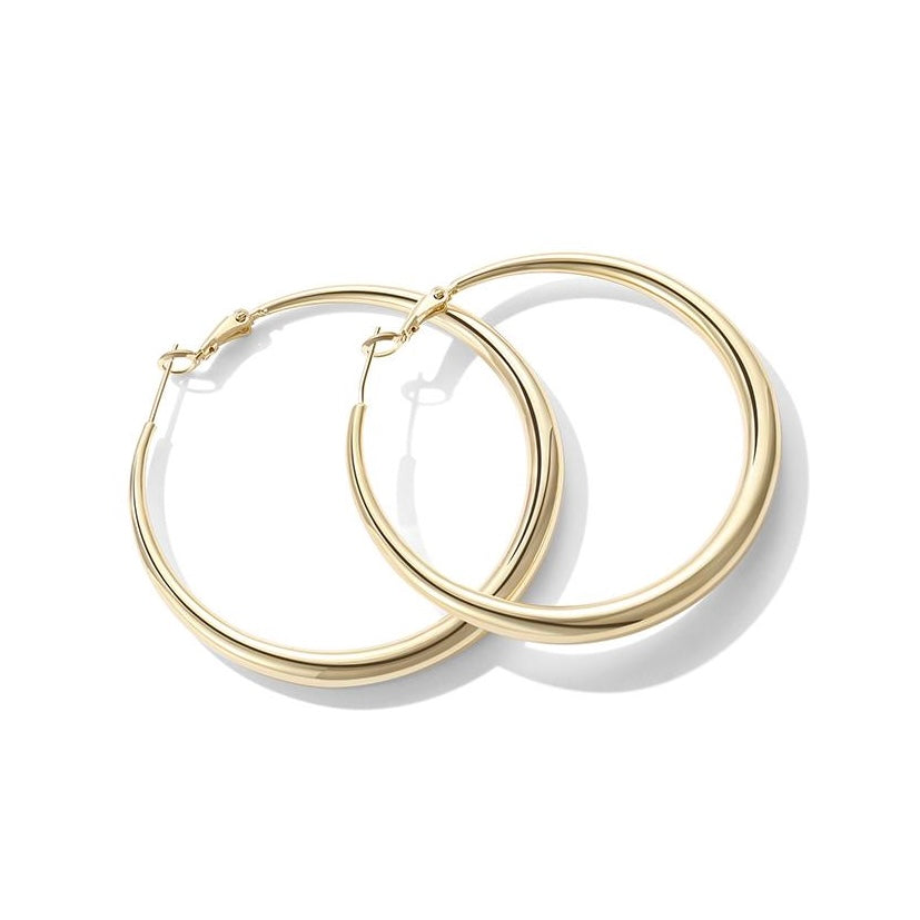 Gold hoop earrings on a white background