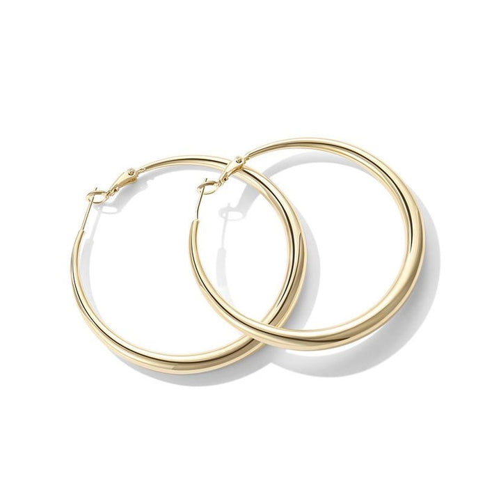 Gold hoop earrings on a white background