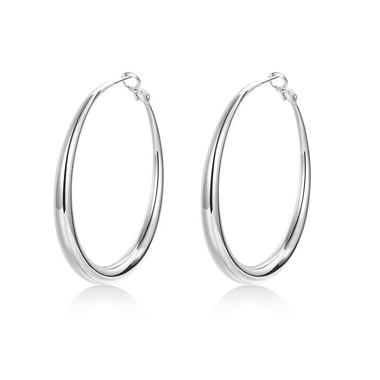 Pair of silver hoop earrings on a white background