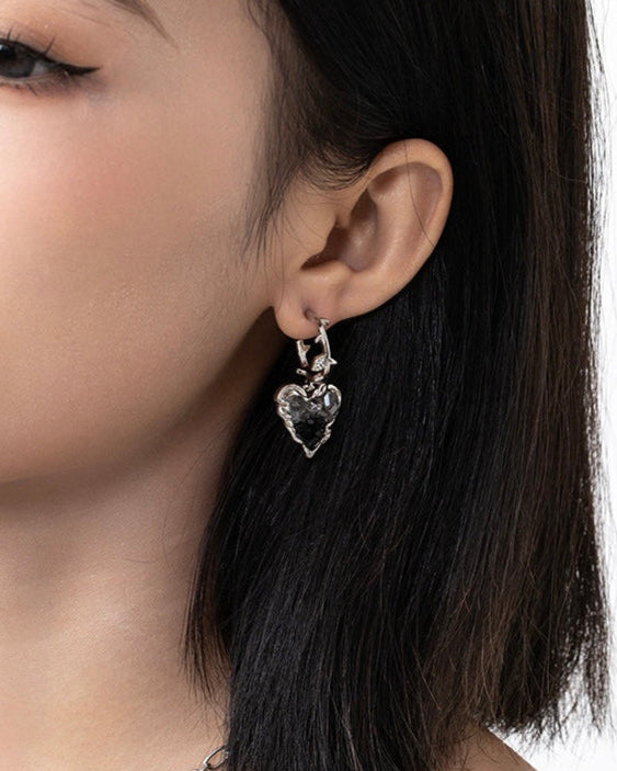 Black Crystal Heart Earrings worn by model showcasing alternate angle and styling
