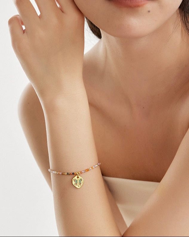 Butterfly Bloom Beaded Bracelet close-up worn on wrist highlighting bead colors and butterfly detail