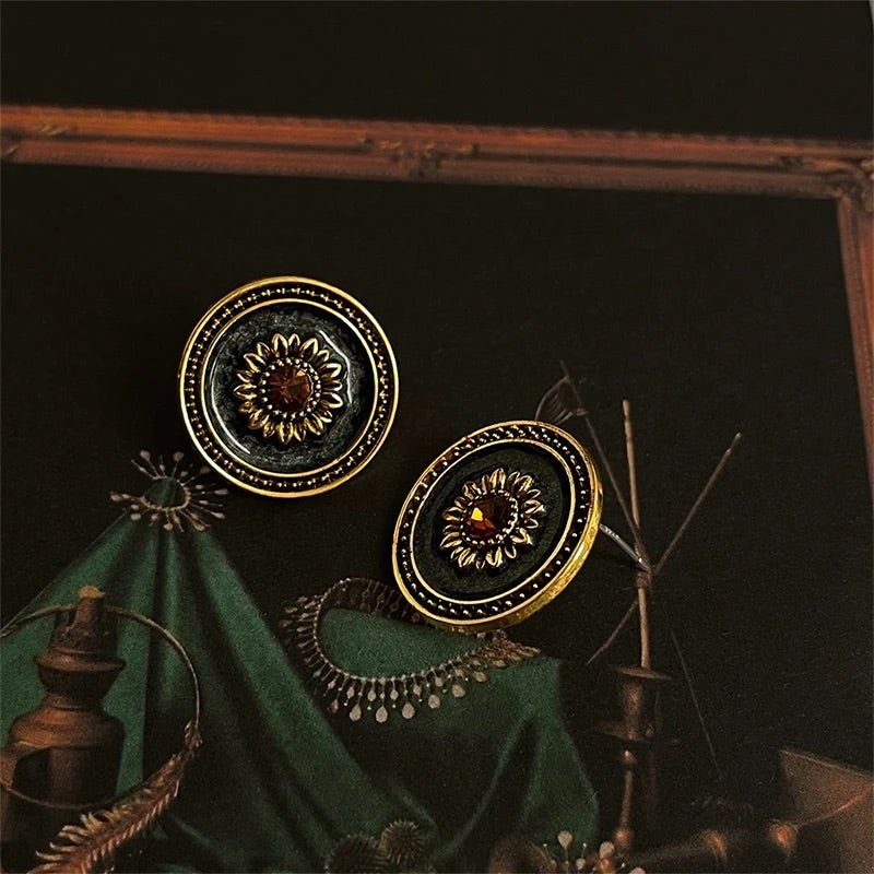 Close-up detail of Celeste Bloom Earrings showing textured gold floral design
