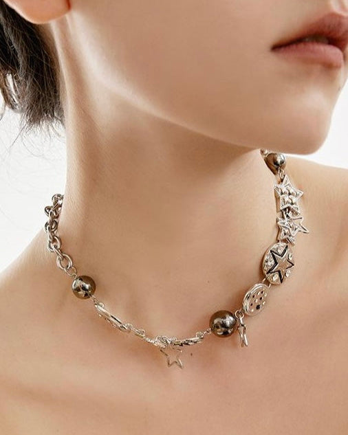 Charm Necklace shown on model with close-up of delicate pendant design