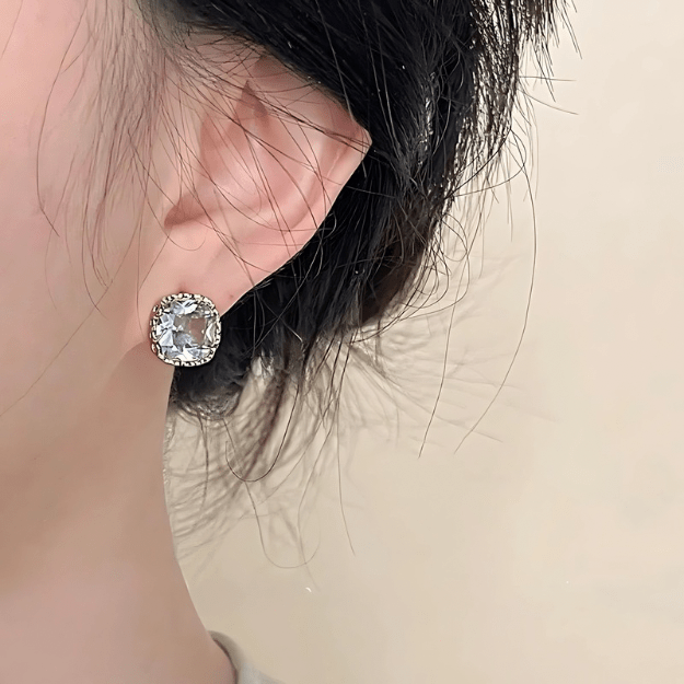 Cushion Cut Stud Earrings worn by model showcasing faceted stone and gold detail
