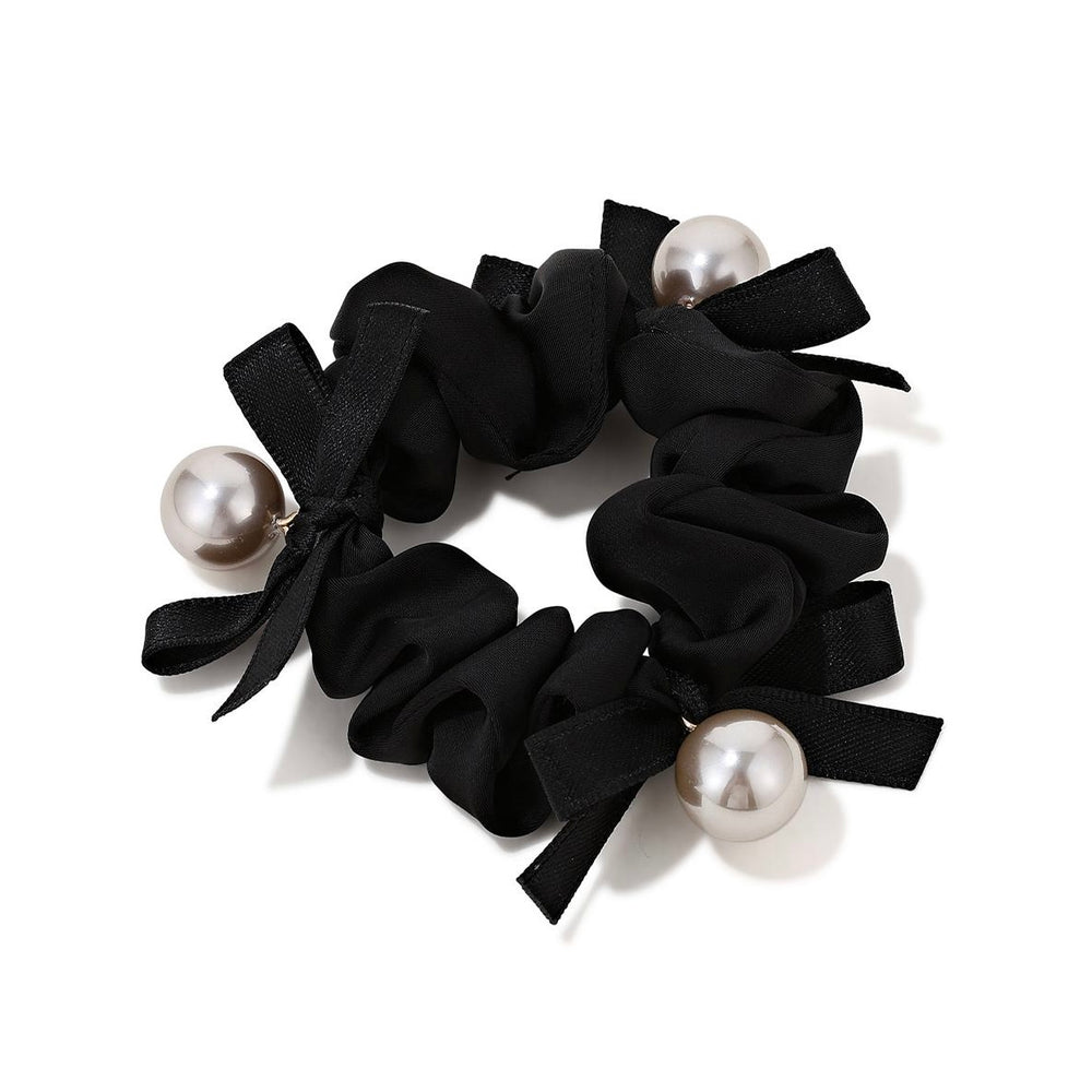 Elegant Pearl Bow Scrunchie in black color with decorative pearls on white background