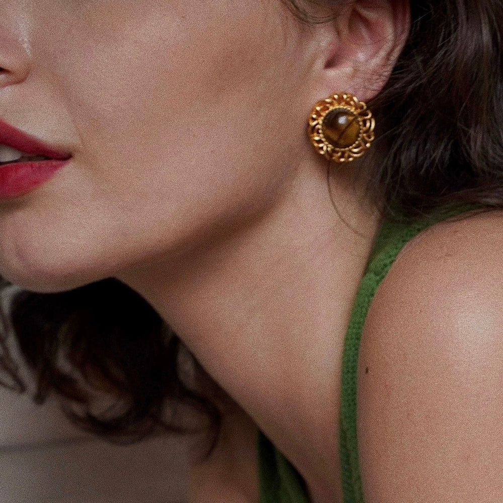 Elysian Earrings close-up worn by model showing sculpted gold detail
