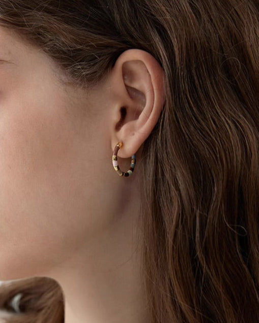Gold Enamel Hoop Earrings worn by model in relaxed lifestyle setting
