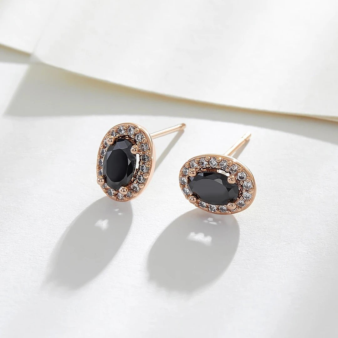 Close-up detail of Gemstone Earrings showing colorful gemstones and gold finish
