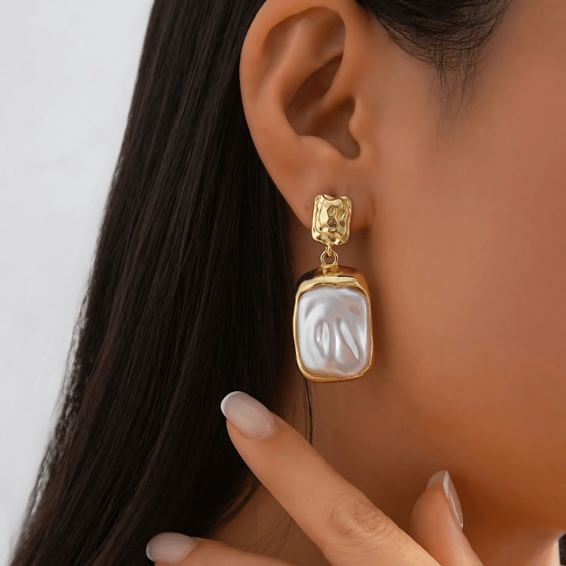 Golden Baroque Pearl Drop Earrings worn by model showcasing gold filigree and baroque pearl detail
