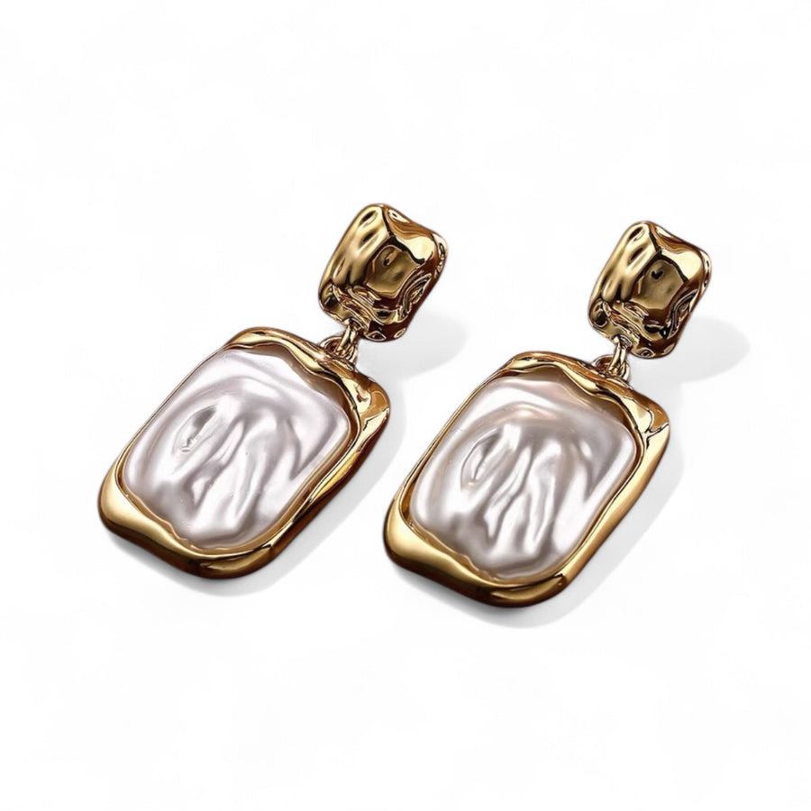 Golden Baroque Pearl Drop Earrings with gold filigree and baroque pearls on white background
