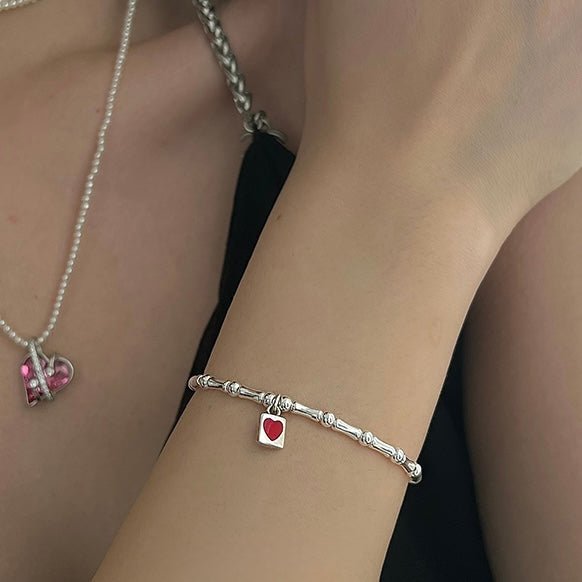 Heart Lock Bracelet close-up worn on model showing heart lock detail