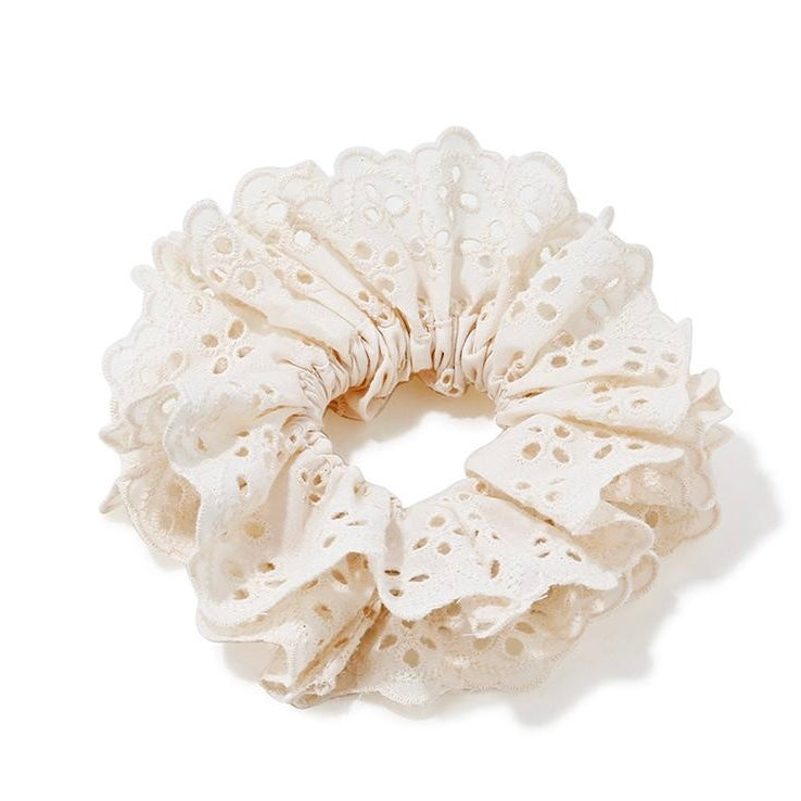 Lace Eyelet Ruffle Scrunchie with ruffled eyelet lace design on white background