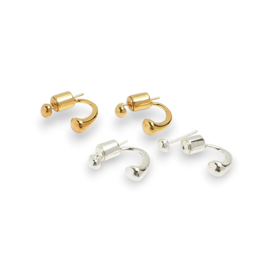 Pair of gold and silver hoop earrings on a white background
