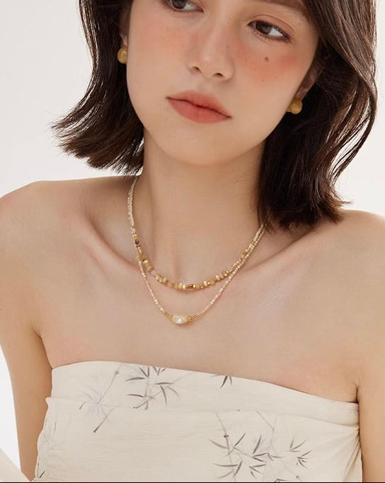Natural Bead Necklace Set in relaxed lifestyle scene worn by model