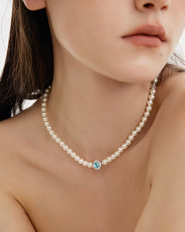 Ocean Whisper Pearl Necklace close-up showing layered pearl strands worn by model