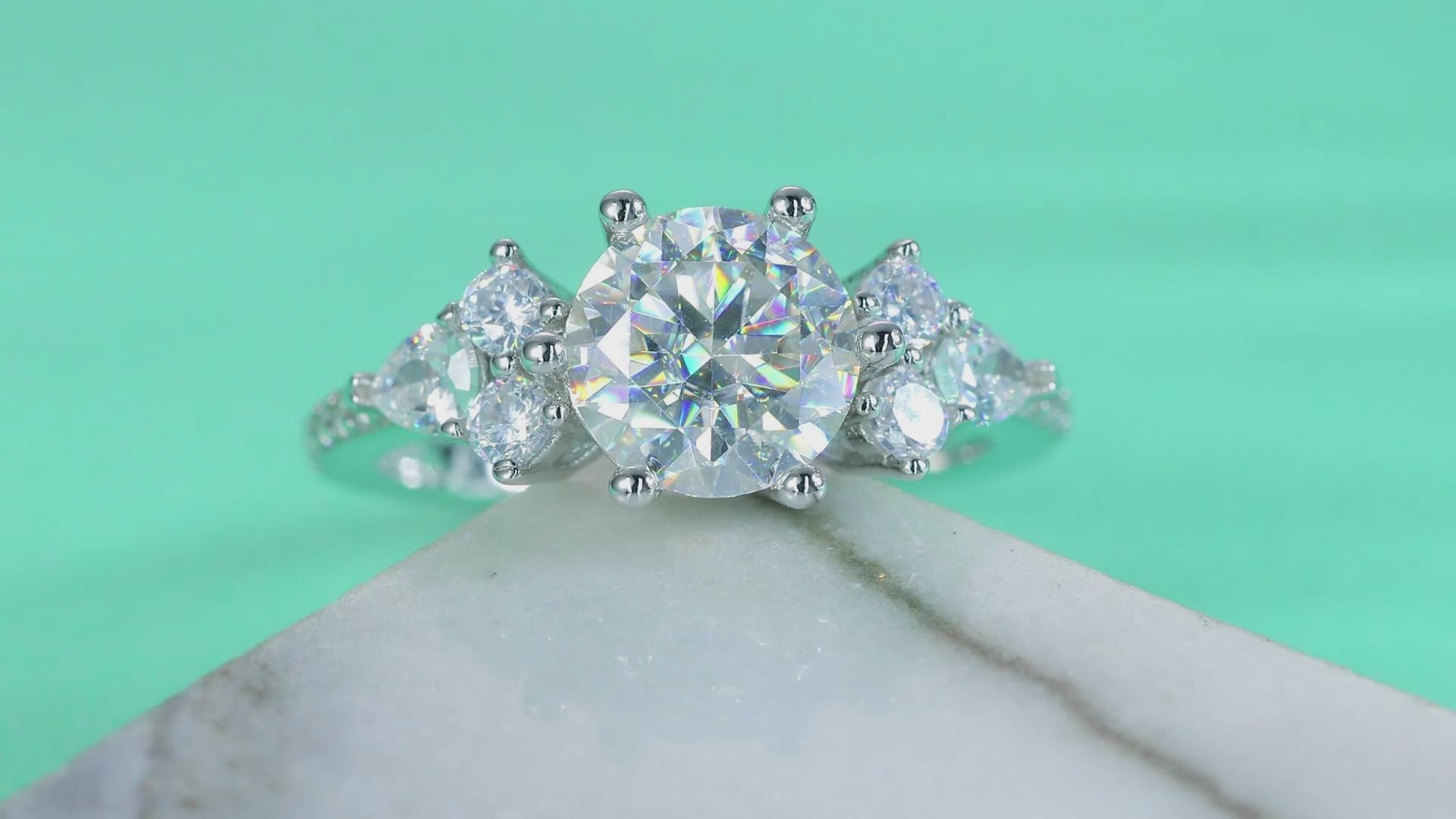 Round Brilliant Moissanite Three-Stone Ring