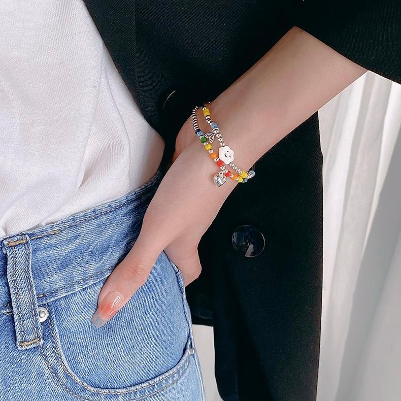 Rainbow Bracelet styled on model with layered wrist accessories