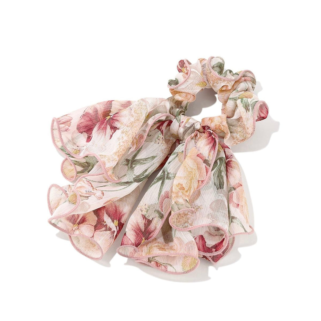 Romantic Floral Bow Scrunchie with close-up of floral fabric and bow detail on white background