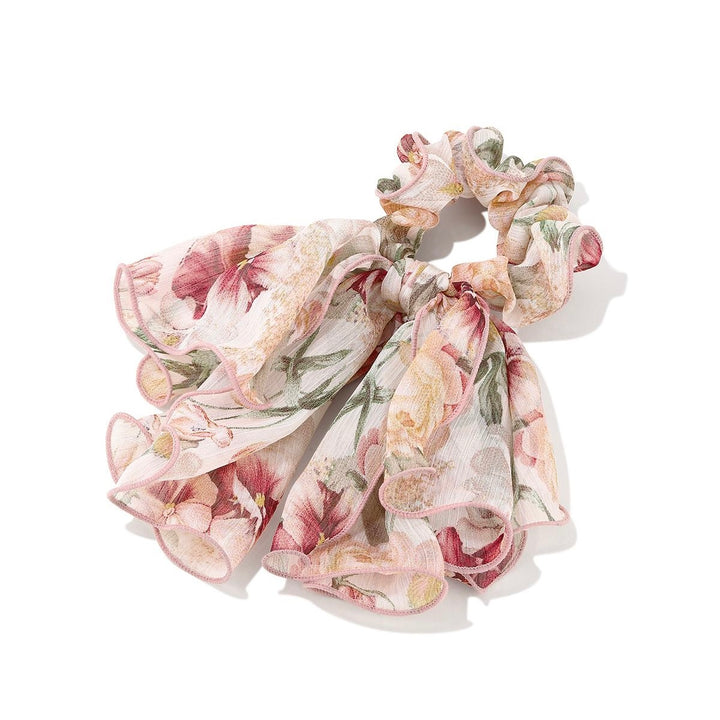 Romantic Floral Bow Scrunchie with close-up of floral fabric and bow detail on white background