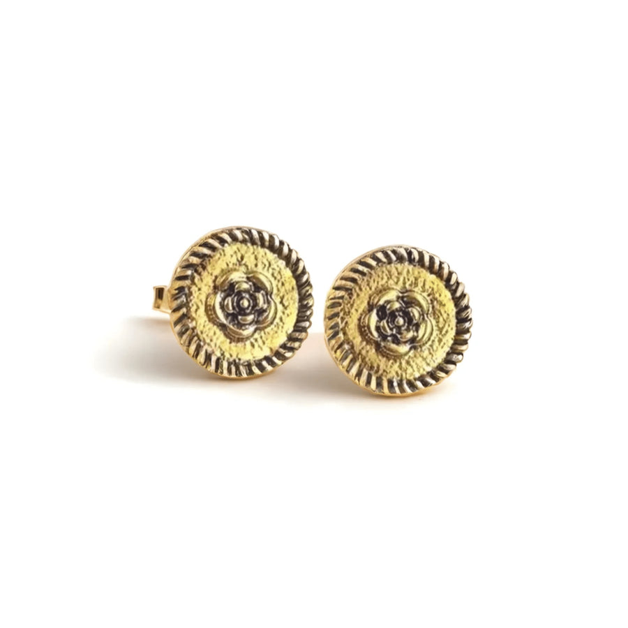 Rose Crest Earrings with gold-tone crest design on white background
