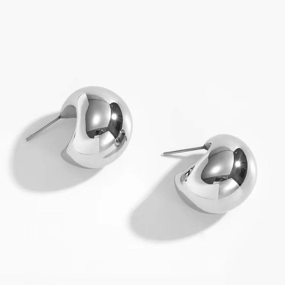 Sculpted Hoop Earrings shown from side angle highlighting sculpted gold detail on white background
