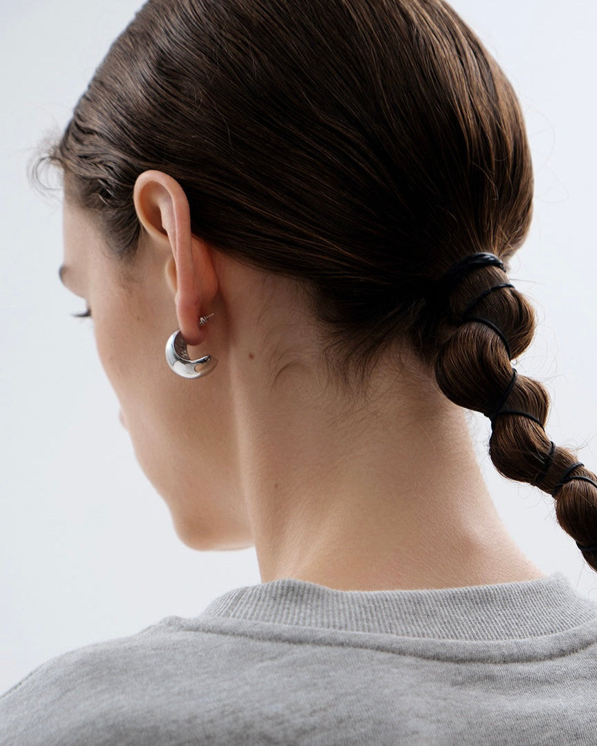 Sculpted Hoop Earrings styled on model with casual outfit
