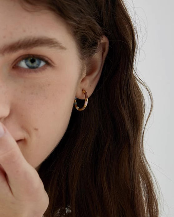 Gold Enamel Hoop Earrings close-up worn by model showing enamel detail and gold finish
