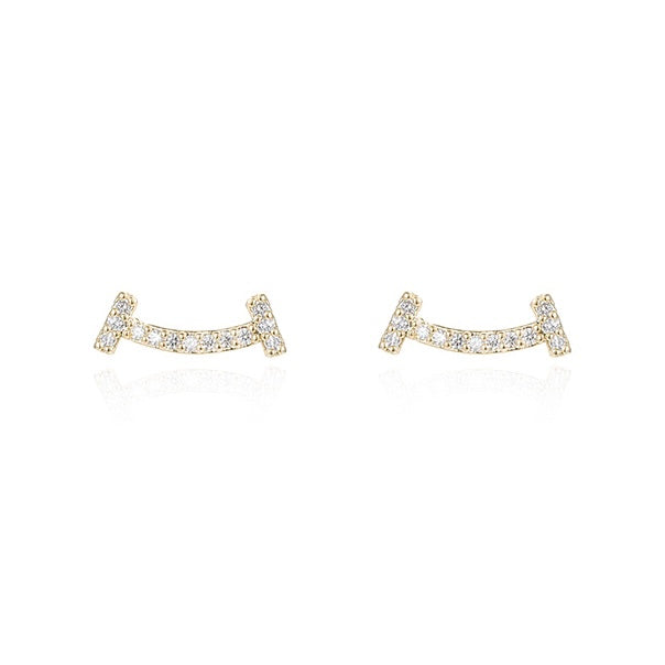Pair of gold earrings with small diamonds on a white background
