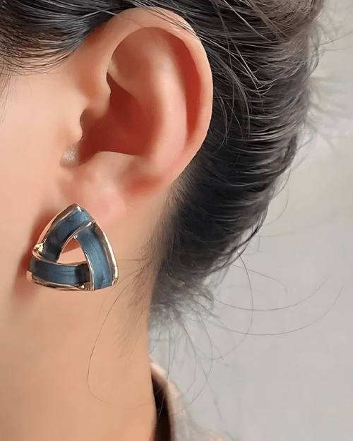 Triangle Earrings worn by model showing geometric gold shape and fit