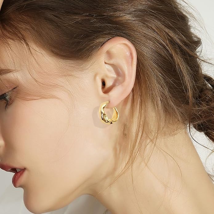 Twist Hoop Earrings worn by model showing twisted gold detail and fit