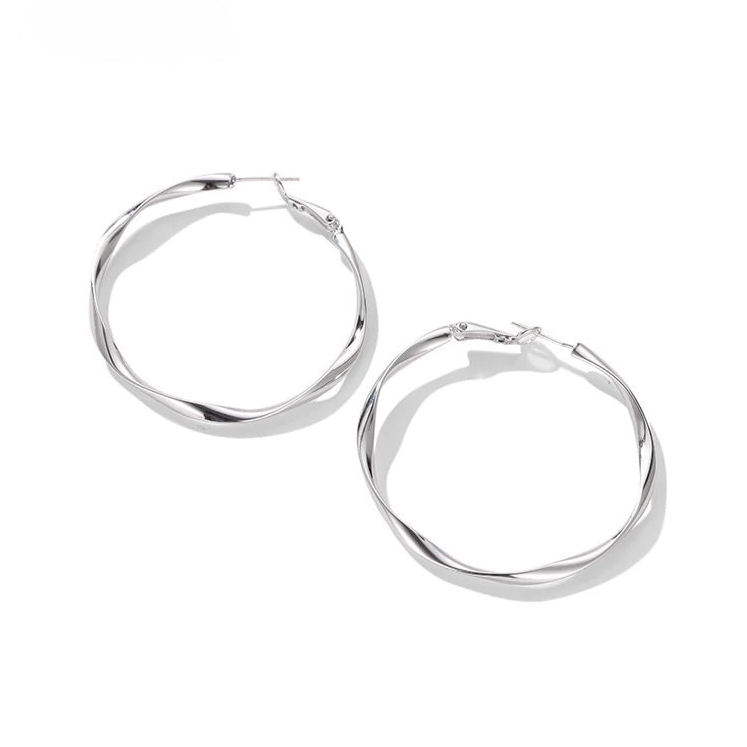Twist Shine Hoop Earrings with polished twisted gold design on white background
