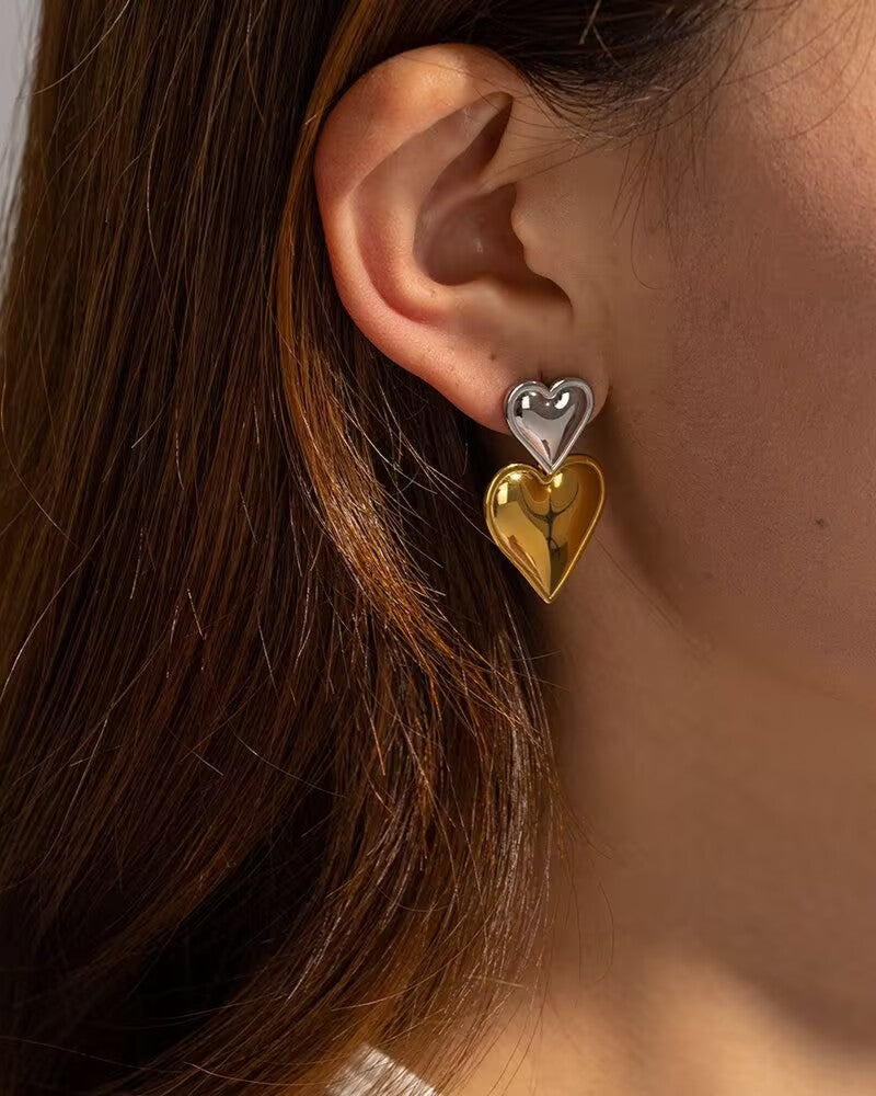 Two-Tone Heart Earrings styled on model with casual outfit
