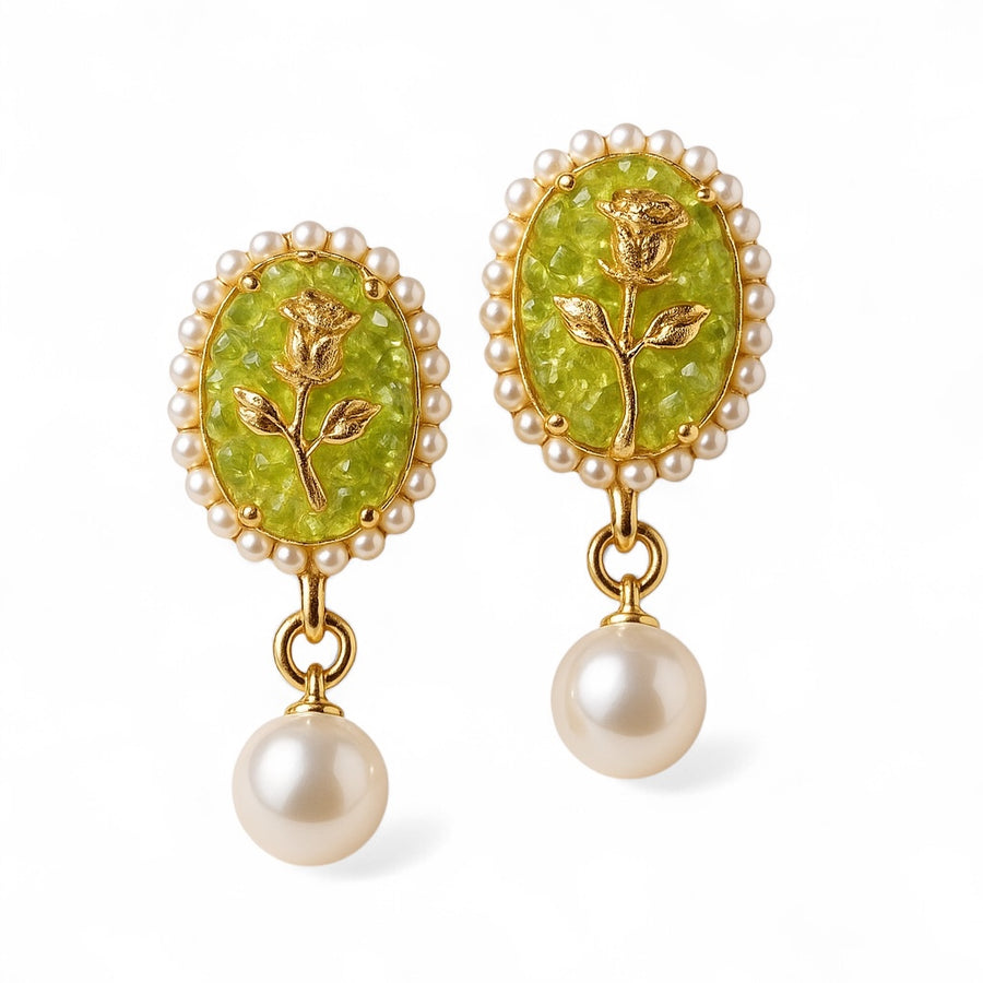 Vintage Pearl Earrings with classic gold setting and round pearls on white background