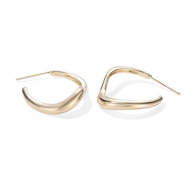 Wave Hoop Earrings shown from side angle highlighting sculpted wave shape on white background

