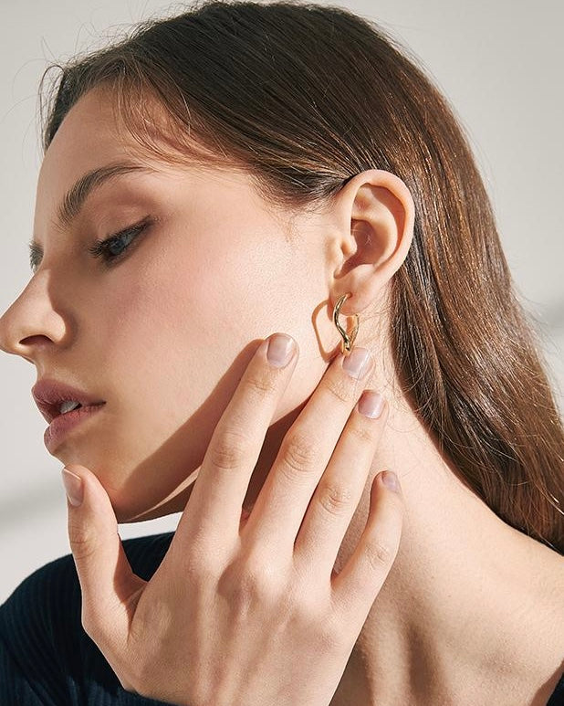 Wave Hoop Earrings styled on model with casual outfit
